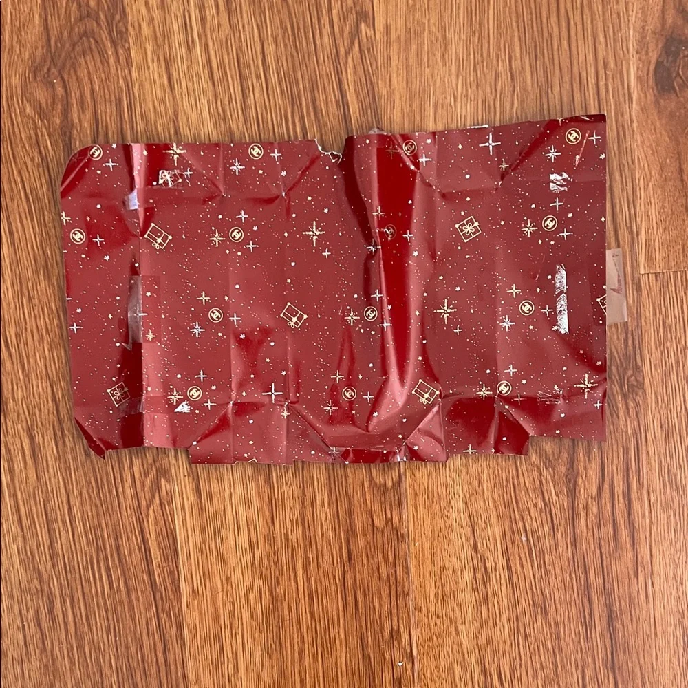 CHANEL Red Gift Wrap with Festive Patterns